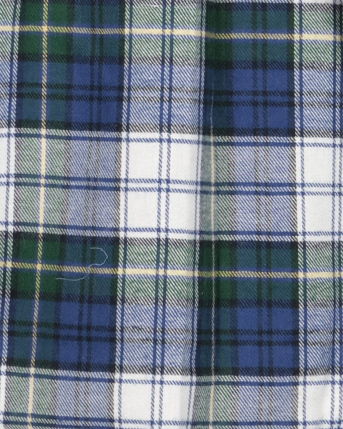 Flanel in wit-groene Schotse ruit van dichtbij