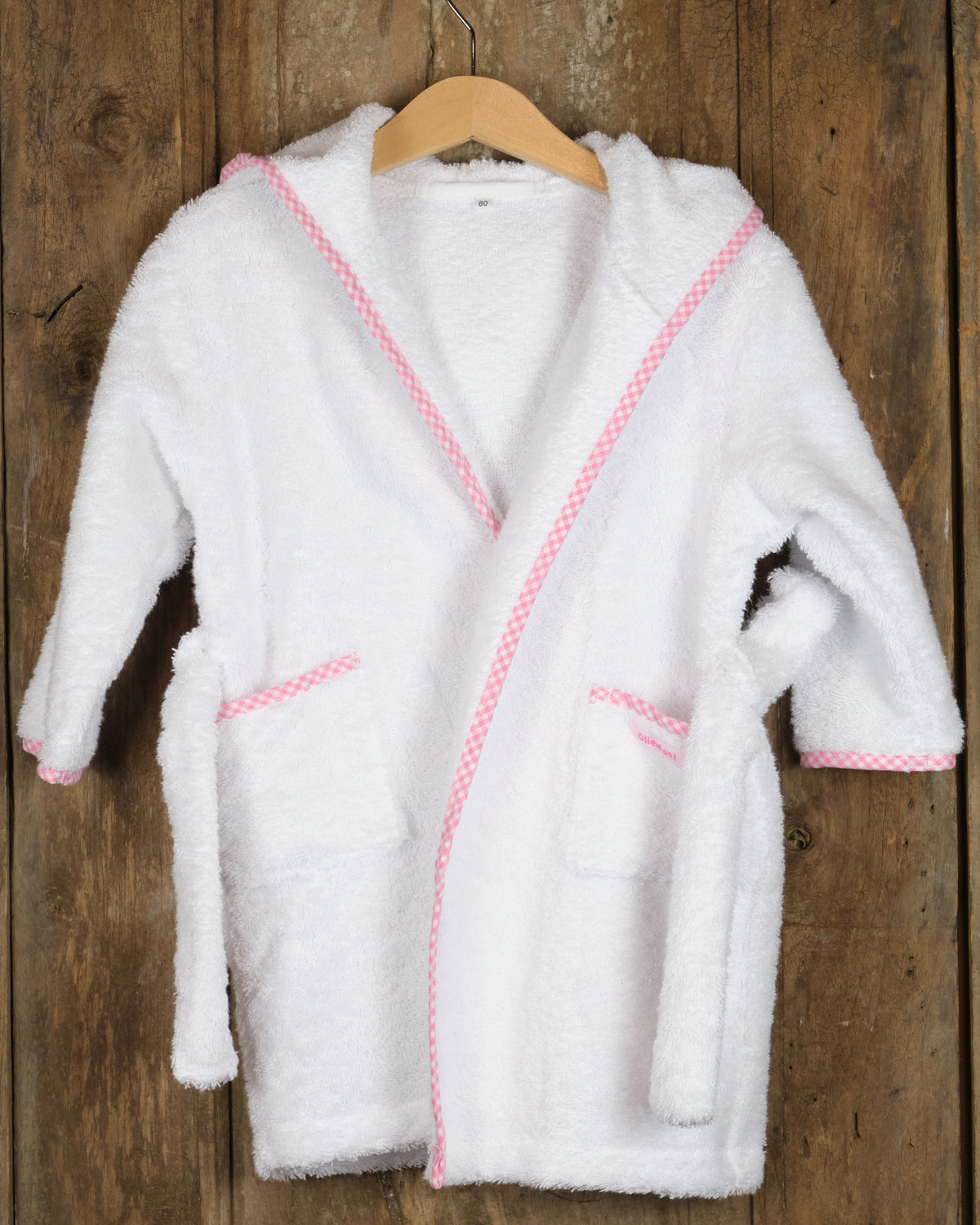 Badjas voor peuters van badstof, wit met roze, voorkant