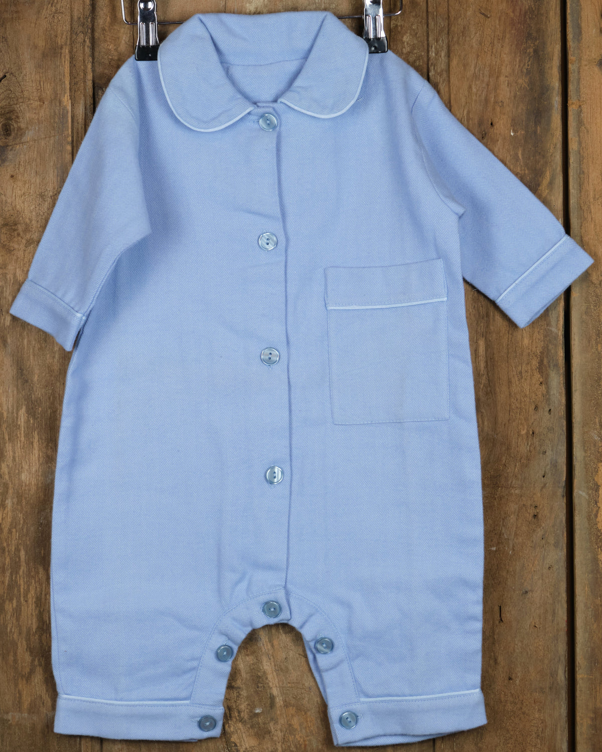 Eendelige flanellen babypyjama in effen blauw, voorkant