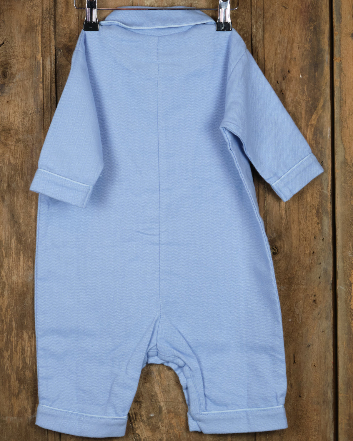Eendelige flanellen babypyjama in effen blauw, achterkant