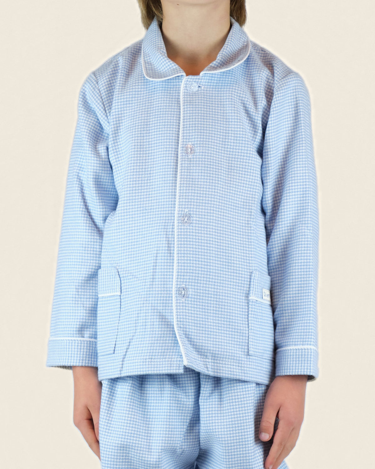 Flanellen kinderpyjama in blauw-witte ruit, jasje met kraag en knopen